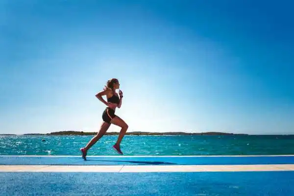 Woman running showing strong leg muscle Walsall